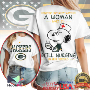 Green Bay Packers Snoopy Nurse Never Underestimate A Woman Still Nursing In Her Sixties T Shirt